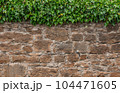 Old stone wall to be used as a background or texture. Ancient wall from old city. 104471605
