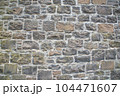 Old stone wall to be used as a background or texture. Ancient wall from old city. 104471607