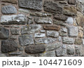 Old stone wall to be used as a background or texture. Ancient wall from old city. 104471609