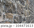 Old stone wall to be used as a background or texture. Ancient wall from old city. 104471613