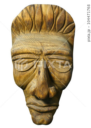 Mask of human face is carved out of wood. Antique religious totem of natives or people of ancient 104471768