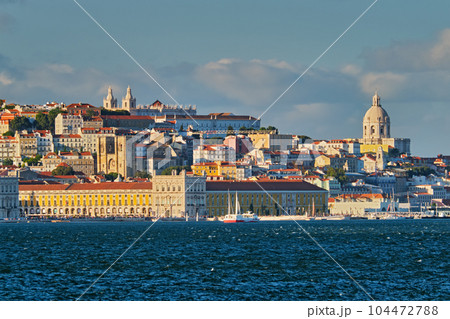 View of Lisbon over Tagus river from Almada with yachts tourist boats on sunset. Lisbon, Portugal View of Lisbon over Tagus river from Almada with yachts tourist boats on sunset. Lisbon, Portugal 104472788