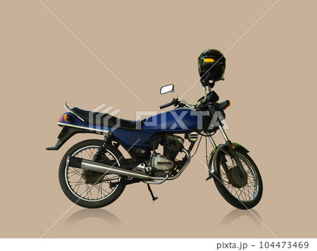 antique blue motorcycle and black helmet on brown background, transportation, object, vintage, classic, copy space 104473469