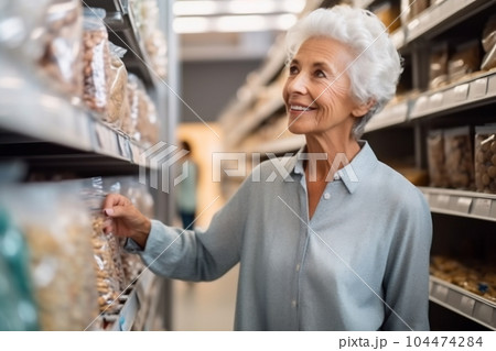 Portrait of middle-aged woman choosing new items in the mall 104474284