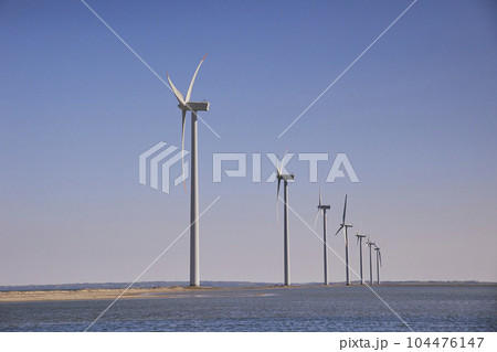 Wind turbines in the North Sea in Denmark at sunset Wind turbines in the North Sea in Denmark at sunset 104476147