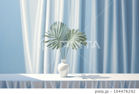 Light blue wall with shade and plant on the floor in a vase 104476292