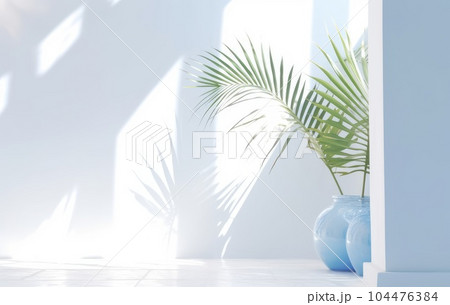 Light blue wall with shade and plant on the floor in a vase Light blue wall with shade and plant on the floor in a vase 104476384