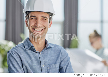 portrait of a confident businessman in a protective helmet portrait of a confident businessman in a protective helmet 104478377