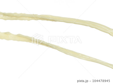Tofu Soybean soymilk pour fall down in line shape form. Soybean milk from tofu spill splash in droplet as paint color. White background isolated high speed shutter freeze motion Tofu Soybean soymilk pour fall down in line shape form. Soybean milk from tofu spill splash in droplet as paint color. White background isolated high speed shutter freeze motion 104478945