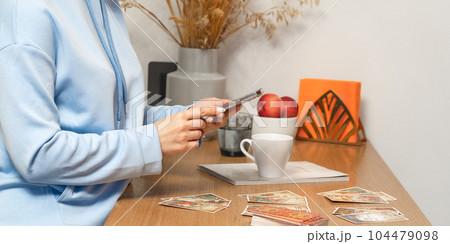 Woman makes a forecast of Tarot cards, Fortune telling esoteric predictions Woman makes a forecast of Tarot cards, Fortune telling esoteric predictions 104479098