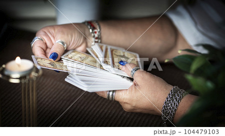 Concept of psychic advisor or ways of divination with cards. Concept of psychic advisor or ways of divination with cards. 104479103