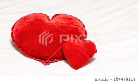 Two Red hearts shaped pillow on bed in bedroom. Valentine's day couple concept. 104479118