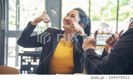 Thumbs up team hand satisfaction job with positive happy good sign. Close up business people partner hand Positive idea good sign. Teams trust Gesture sign Thumbs up together as teamwork partnership 104479422