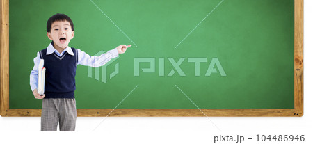 Excited little boy pointing  casual clothes books  104486946