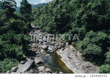 Beautiful waterfall in deep tropical rain forest nature landscape Beautiful waterfall in deep tropical rain forest nature landscape 104490355