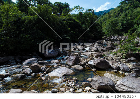 Beautiful waterfall in deep tropical rain forest nature landscape Beautiful waterfall in deep tropical rain forest nature landscape 104490357