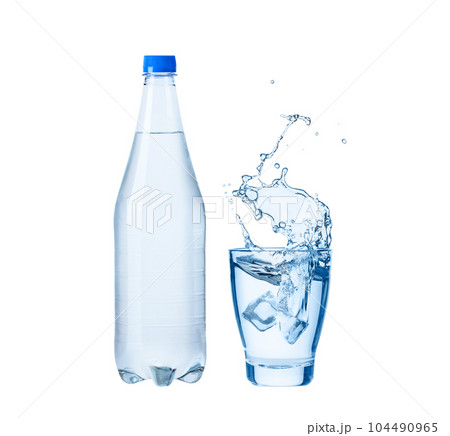 Ice cube splashes into glass of drinking water and bottle of water Ice cube splashes into glass of drinking water and bottle of water 104490965