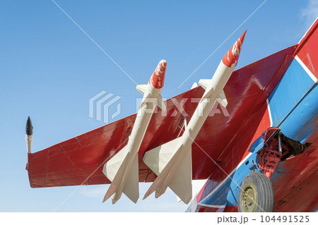 combat aircraft fighter bomber on a blue sky background combat aircraft fighter bomber on a blue sky background 104491525
