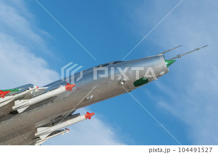 combat aircraft fighter bomber on a blue sky background combat aircraft fighter bomber on a blue sky background 104491527