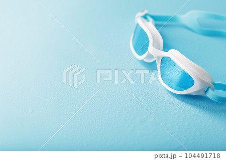 White swimming glasses with a blue lens White swimming glasses with a blue lens 104491718