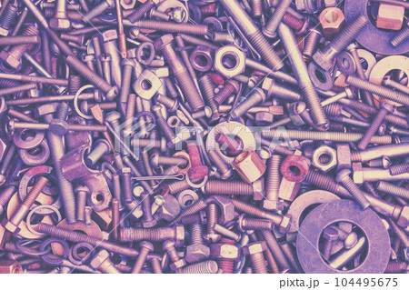Abstract grunge metal background from bolts, screws, nuts, and washers Abstract grunge metal background from bolts, screws, nuts, and washers 104495675