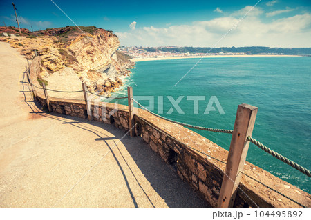 Atlantic ocean, embankment in Nazare, Portugal, Europe 104495892