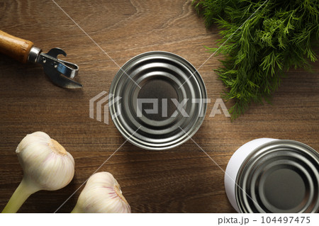 Canned food in blank metal jars, concept of canned food Canned food in blank metal jars, concept of canned food 104497475
