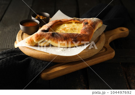 National Georgian cuisine food, flour product - Khachapuri National Georgian cuisine food, flour product - Khachapuri 104497692