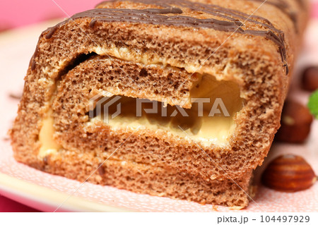 Concept of delicious sweet food - cake roll Concept of delicious sweet food - cake roll 104497929