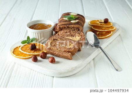 Concept of delicious sweet food - cake roll Concept of delicious sweet food - cake roll 104497934