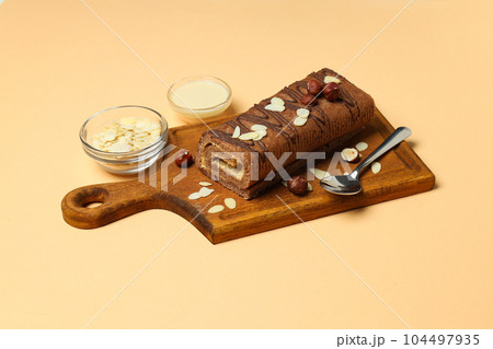 Concept of delicious sweet food - cake roll Concept of delicious sweet food - cake roll 104497935