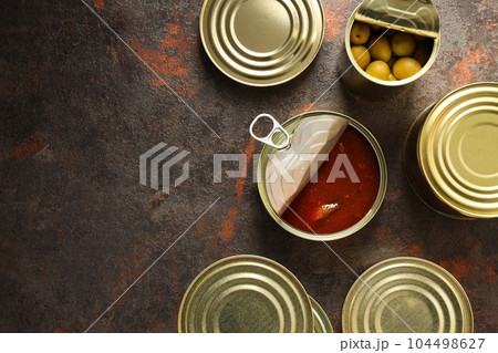 Canned food in blank metal jars, concept of canned food Canned food in blank metal jars, concept of canned food 104498627
