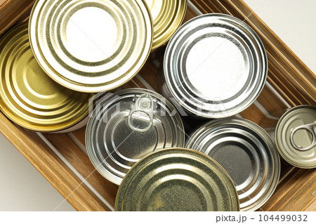 Canned food in blank metal jars, concept of canned food Canned food in blank metal jars, concept of canned food 104499032