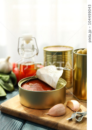 Canned food in blank metal jars, concept of canned food Canned food in blank metal jars, concept of canned food 104499043