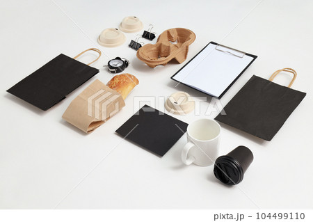 Mockup flat lay with different office accessories on white background Mockup flat lay with different office accessories on white background 104499110