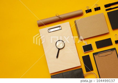 Mockup flat lay with different office accessories on yellow background 104499137