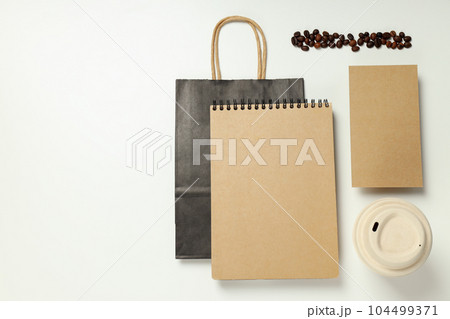 Mockup flat lay with craft accessories and coffee beans on white background 104499371