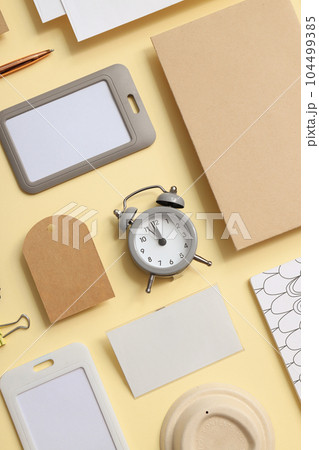 Mockup flat lay with different office accessories on beige background 104499385