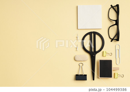 Mockup flat lay with different office accessories on beige background Mockup flat lay with different office accessories on beige background 104499386