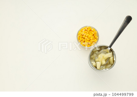 Ingredients for cooking salad, corn seeds and canned pineapple 104499799