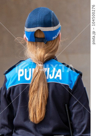 Malta, policewoman seen from the back in the streets of Valletta 104500276