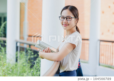 Portrait University Asian teen girl using tablet modern learning education lifestyle in school campus. Portrait University Asian teen girl using tablet modern learning education lifestyle in school campus. 104500789