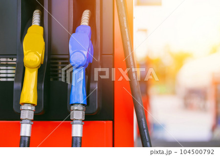 fuel gas station, closeup gasoline fuel nozzle petroleum benzine and diesel or gasohol colors type. fuel gas station, closeup gasoline fuel nozzle petroleum benzine and diesel or gasohol colors type. 104500792