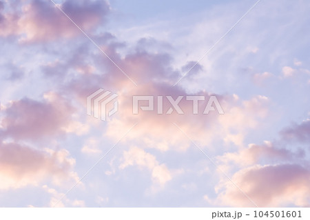 Background of blue sky with pale pink clouds at sunset 104501601