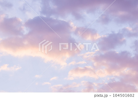 Background of blue sky with pale pink clouds at sunset 104501602