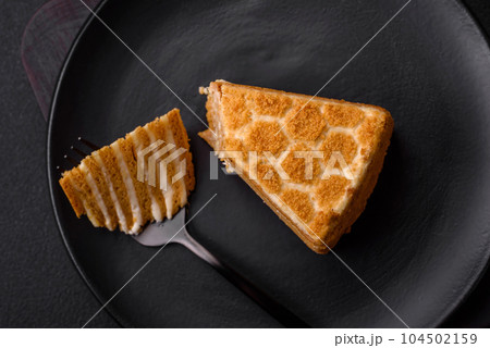 Delicious fresh sweet honey cake layer cake with white cream Delicious fresh sweet honey cake layer cake with white cream 104502159