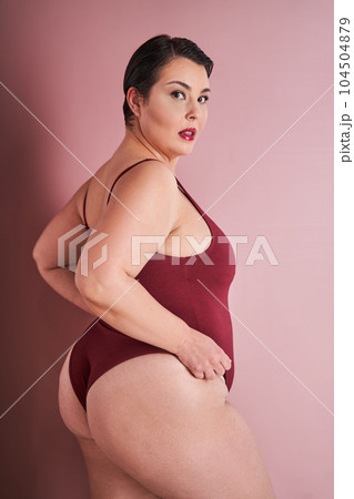 Vertical portrait of the asian woman feeling proud in her natural body 104504879