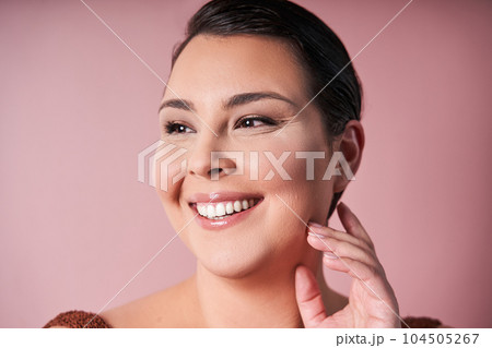 Happy young woman looking away feeling proud of her natural body Happy young woman looking away feeling proud of her natural body 104505267