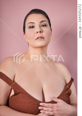 Portrait of body positive black lady with perfect smooth skin posing Portrait of body positive black lady with perfect smooth skin posing 104505272