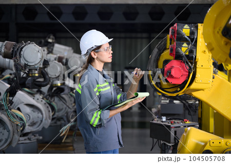 Maintenance engineer worker working with robotic machine automation 104505708